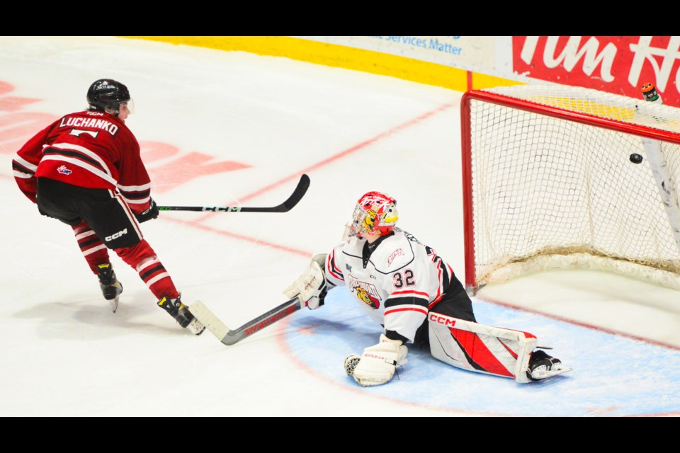 Guelph Storm's Jett Luchanko beats Owen Sound Attack goaltender Carter George for the lone goal of the shootout Friday at the Sleeman Centre.