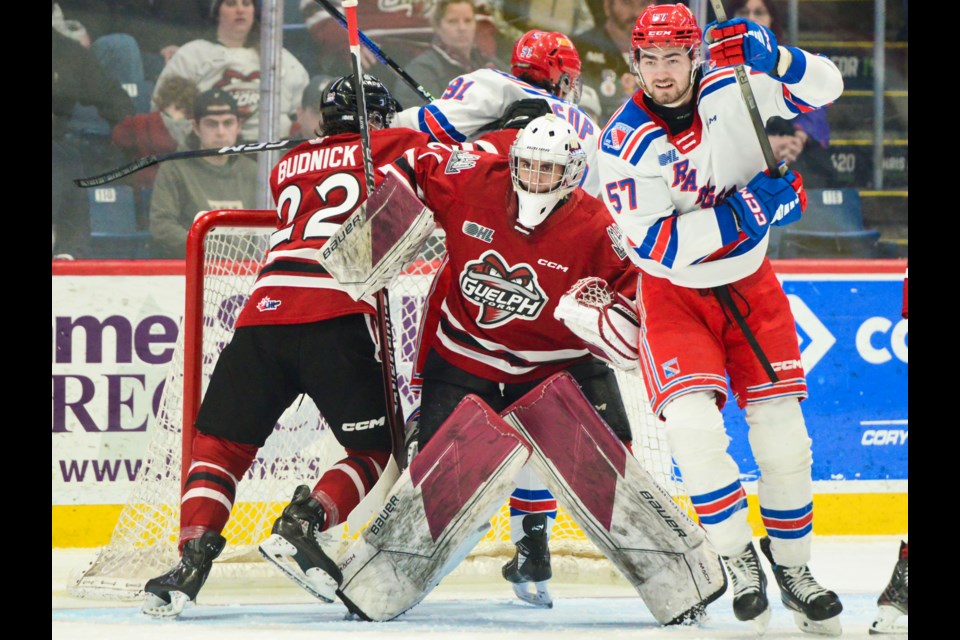 Things get a little busy around Guelph Storm goaltender Damian Slavik Sunday at the Sleeman Centre.
