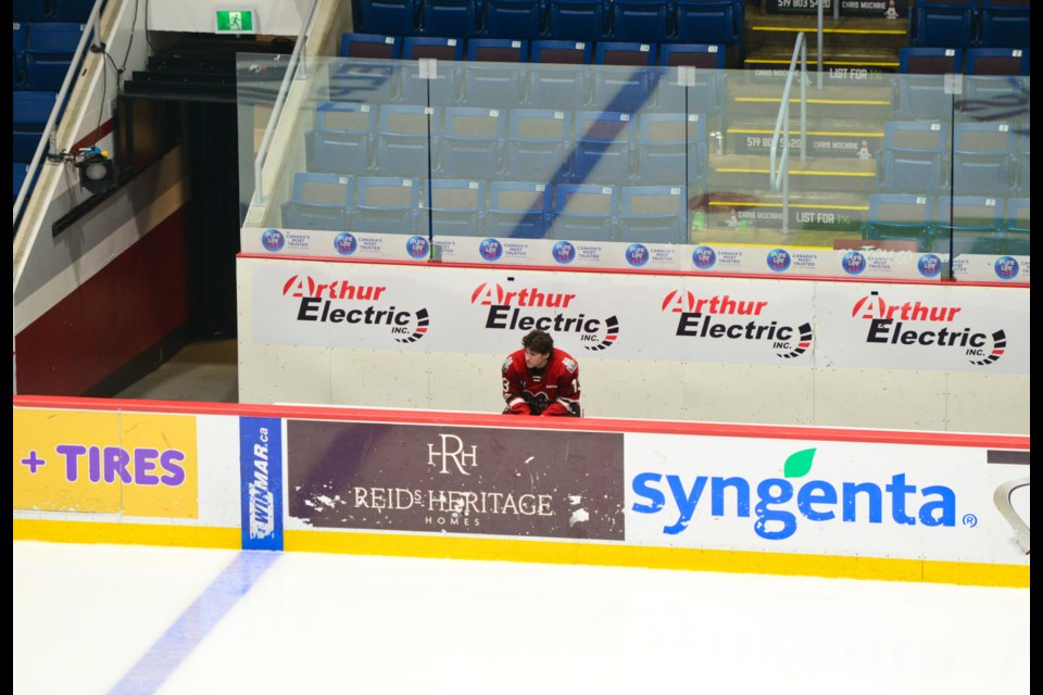 Guelph Storm rookie Quinn Beauchesne sits on the Storm bench long after the end of the team's season-ending loss at the Sleeman Centre Wednesday night.