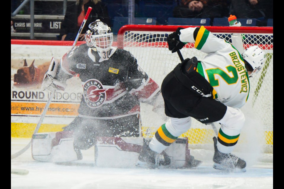 Zach Jovanovski of the Guelph Storm makes a save on the London Knights' Brzustewicz Wednesday at the Sleeman Centre.