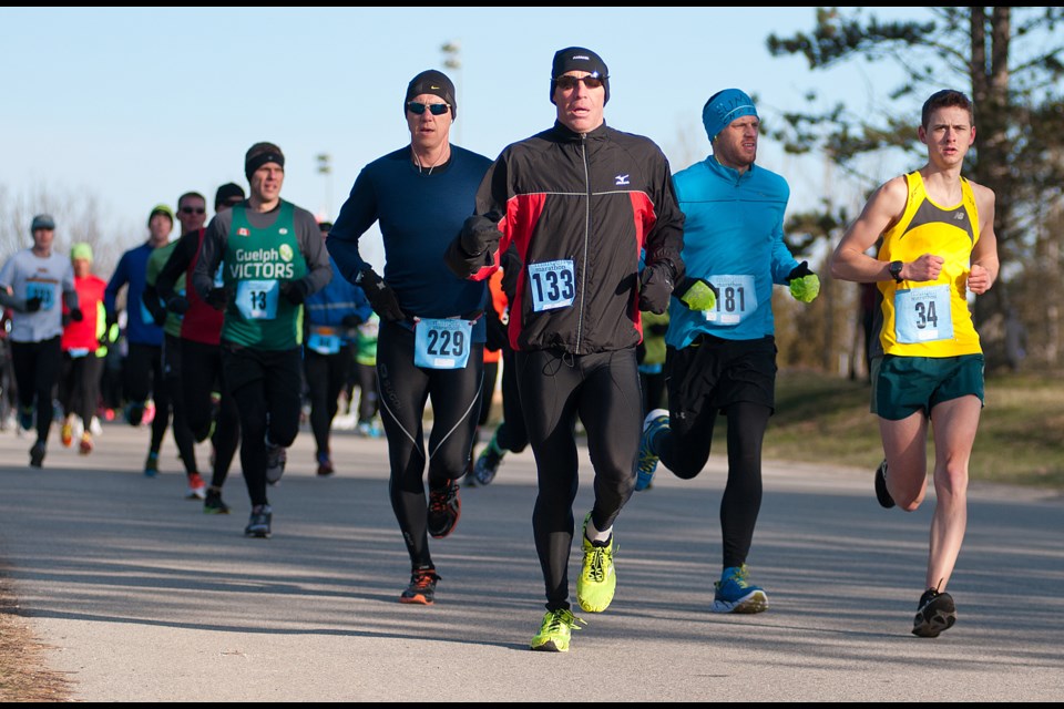 Eventual winner Ken MacAlpine (133) leads a group of runners that includes Jonathan Wright (229), Jeff Rowthorn (181) and Daniel Burke (34) at the beginning of the Marden Marathon's half marathon Saturday. MacAlpine won for the third time in four years. Rob Massey for GuelphToday