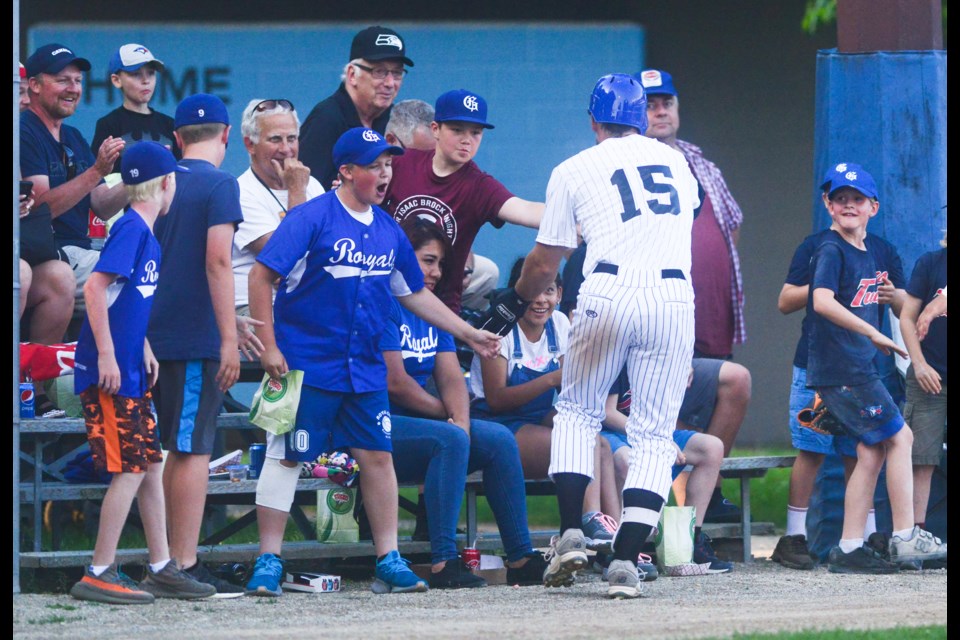 Josh Garton of the Guelph Royals celebrates with some fans after hitting a home run Saturday against the Toronto Maple Leafs at Hastings Stadium. Tony Saxon/GuelphToday