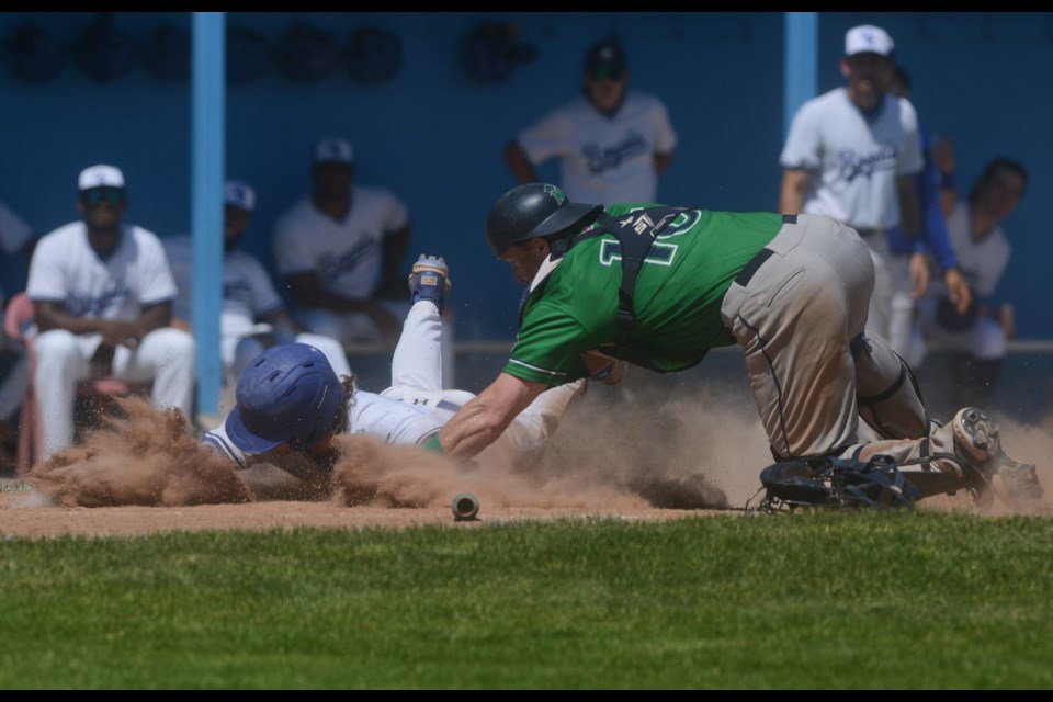 Guelph Royals baserunner Conner Morro slides safely into home during Guelph's 5-4 loss at Hastings Stadium Saturday.