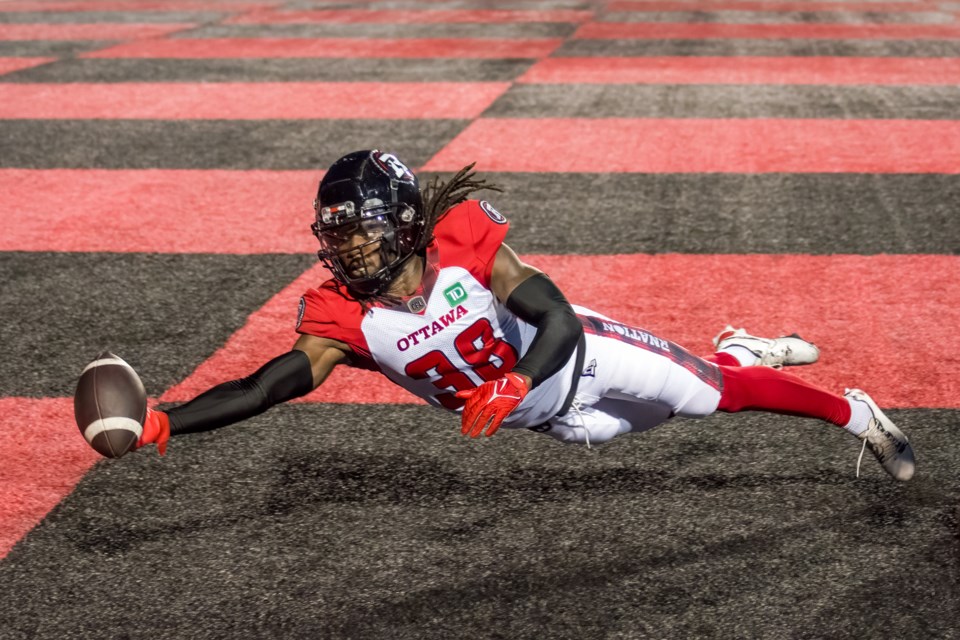 Defensive back Deandre Lamont of the Ottawa Redblacks reaches out to try for an interception in the endzone during Thursday's CFL preseason game against the Toronto Argos at Alumni Stadium. Ottawa claimed a 34-23 win in the match.