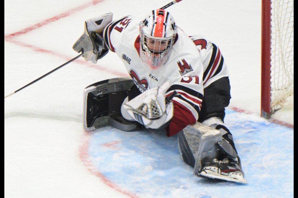 Guelph Storm goaltender Brayden Gillespie, playing in his first OHL game, makes a brilliant glove save in overtime Sunday at the Sleeman Centre.