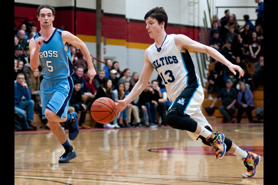 Chris Poloniato (13) of the Bishop Macdonell Celtics starts a charge to the basket as Daniel Street (5) of the Ross Royals tries to catch up during the District 10 senior boys' basketball final Saturday night at the Mitchell Athletics Centre. The Celtics won 60-36. Rob Massey for GuelphToday