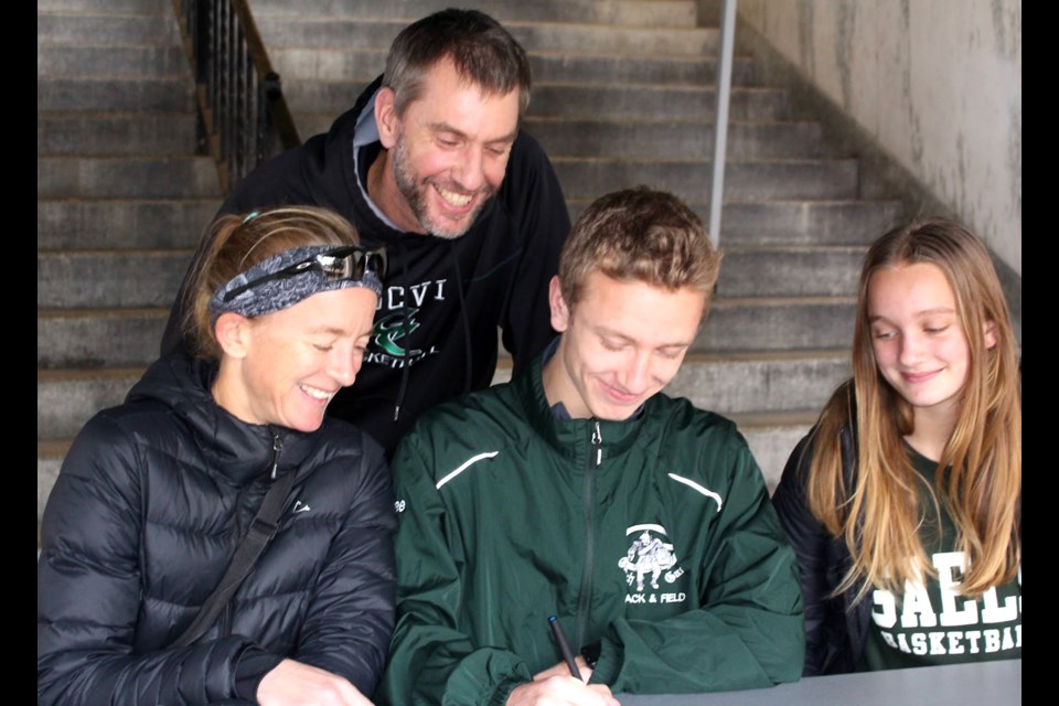 Tennessee Tremain is surrounded by his family – mother Teresa Duck, father Rich Tremain and sister Acadia Tremain – as he signs his Letter of Intent to attend and compete in track and field for Monmouth University in New Jersey beginning next August. Submitted Photo