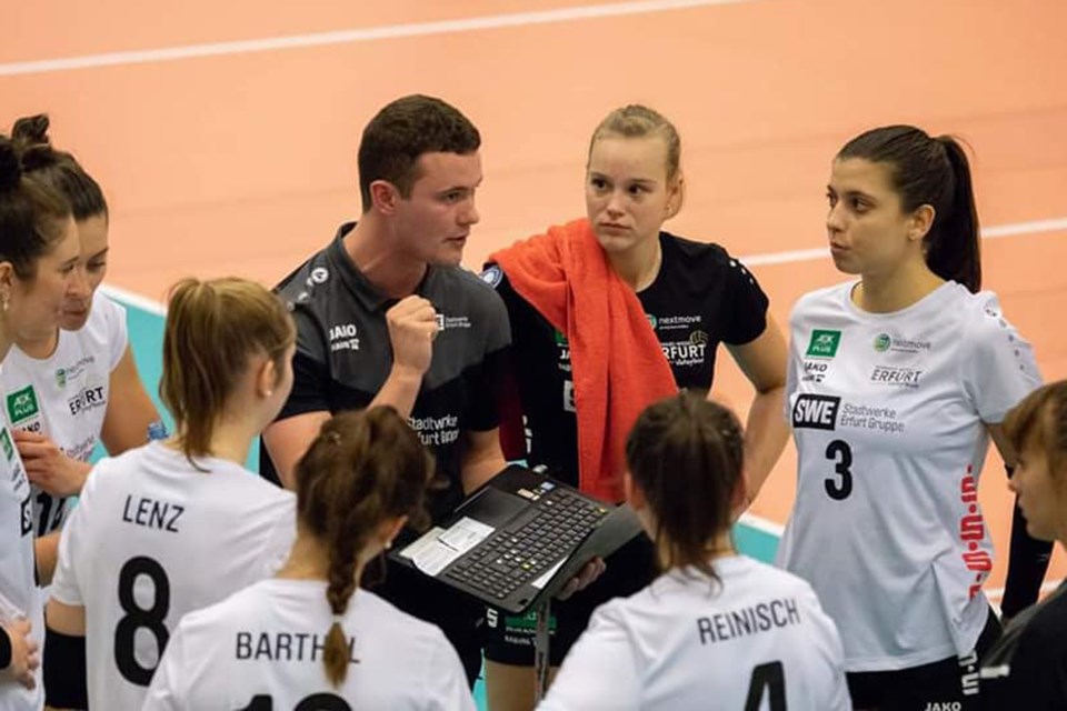 Hayden Nichol of Guelph talks to players of the Schwarz-Weiss Erfurt of the German Womenâs Volleyball Bundesligaâs top division. Nichol is an assistant coach with the team. Submitted photo