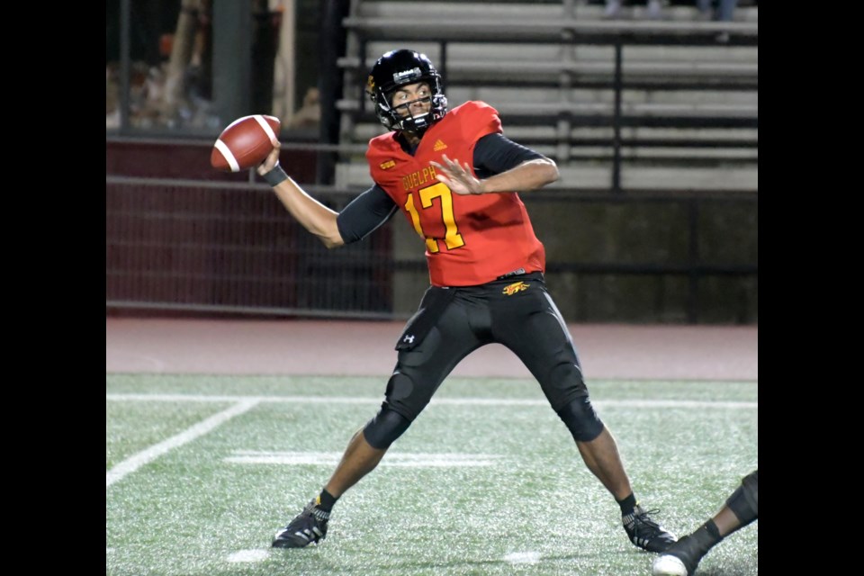 Quarterback Shawn Lal of the Guelph Gryphons reaches back to get ready to unleash a long pass during OUA football action Saturday at Alumni Stadium. The Gryphs defeated the Western Mustangs 23-21.