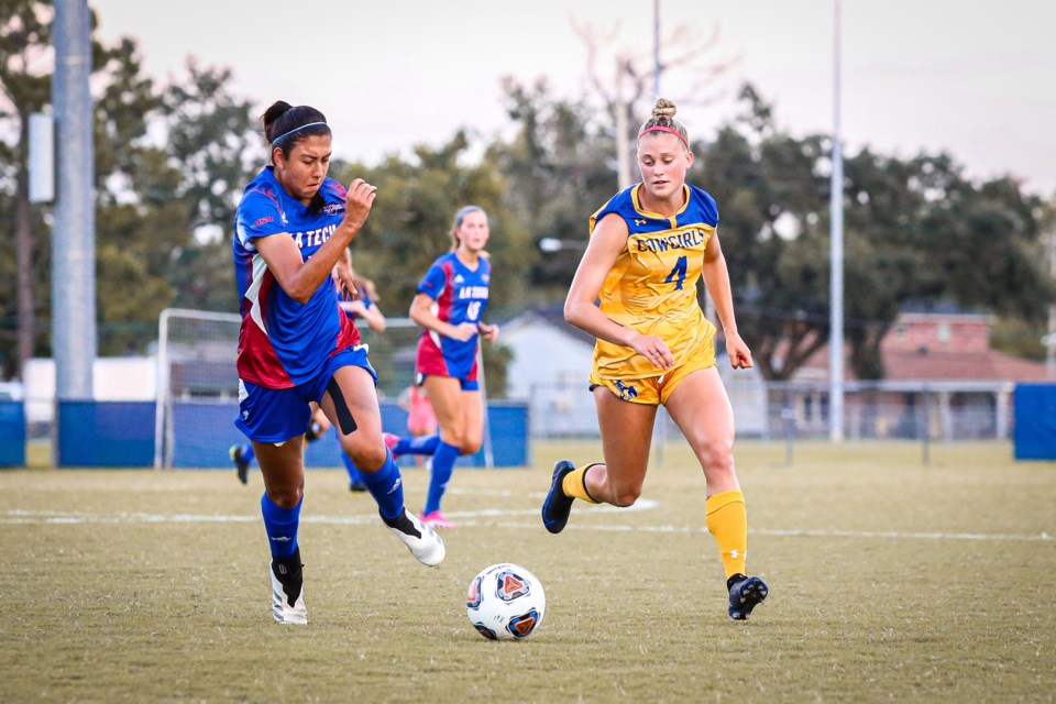 Abbi Morrell of the McNeese State Cowgirls races a Louisiana Tech opponent to the ball during NCAA Division 1 women's soccer play this season. The John F. Ross CVI graduate started 13 games for the Cowgirls this season.