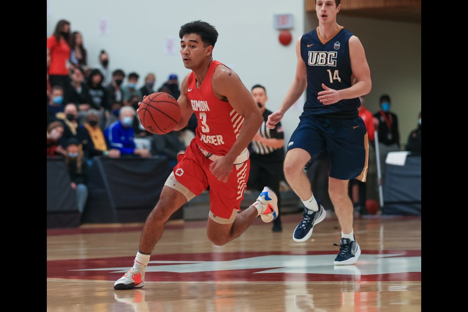 David Penney, left, of the Simon Fraser Clan leads a rush ahead of one of his Guelph buddies, Lincoln Rosebush of the UBC Thunderbirds, in the Buchanan Cup match at SFU. It was played for the first time since 2015 and SFU's win squares the all-time record at 17 wins apiece with one game ending in a tie.