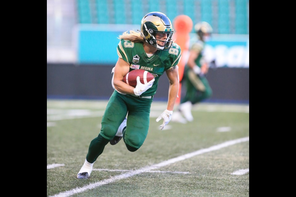 Riley Boersma of the Regina Rams starts heading up the field after catching a pass during Canadian university football play. Boersma's a former St. James Lion and Guelph Junior Gryphon.