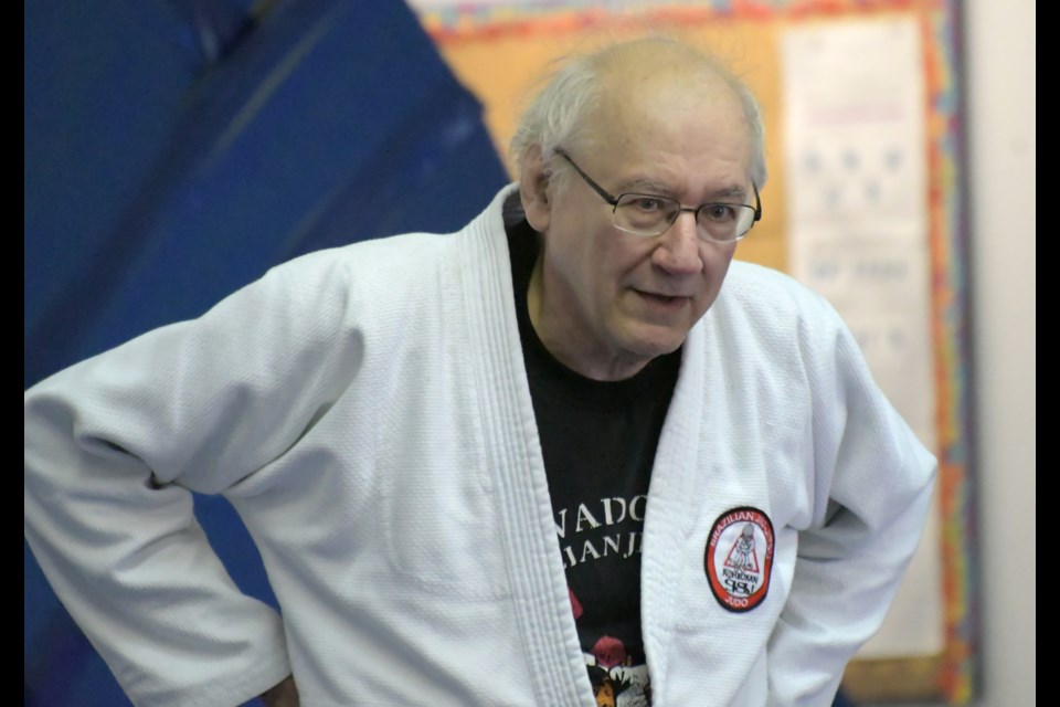 Jim Stevenson of Guelph watches as a martial arts move is explained during a clinic at the Kohboukan Brazilian Jiu-Jitsu and Judo dojo. Following the clinic, Stevenson was promoted to black belt.