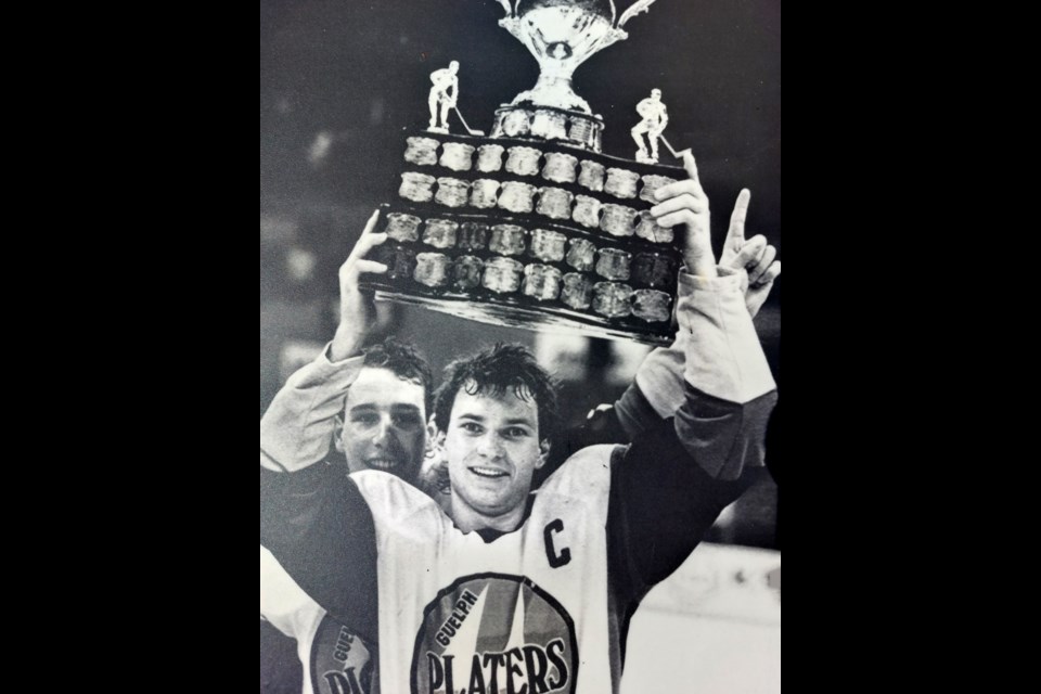 Paul Brydges, captain of the Guelph Platers, lifts the Memorial Cup in victory after their win to complete the 1985-86 major junior hockey season. Brydges is to be inducted into the Guelph Sports Hall of Fame Wednesday as a member of the Hall's Class of 2020.