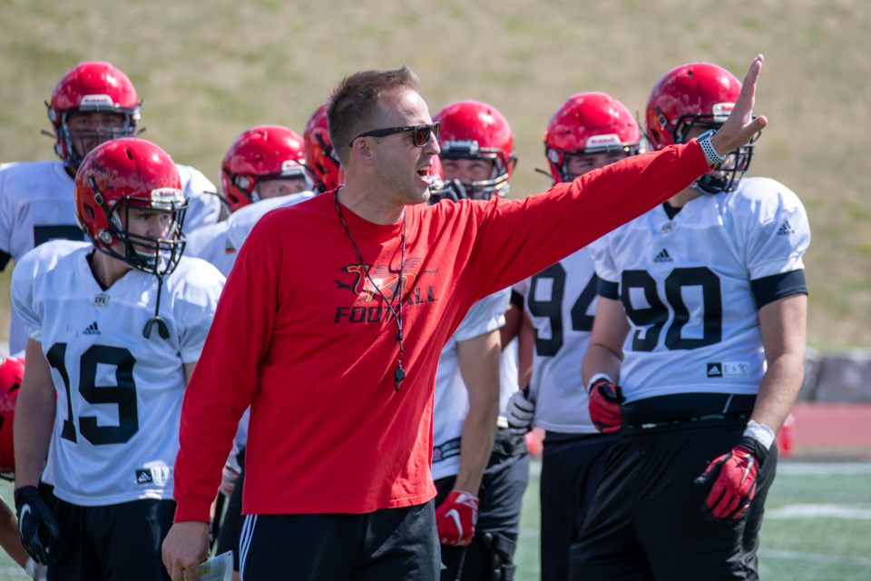 Guelph Gryphons head coach Ryan Sheahan yells instructions to the sidelines during an on-field session at the team's training camp at Alumni Stadium. The team is to open its regular season against the Western Mustangs in London Aug. 27.