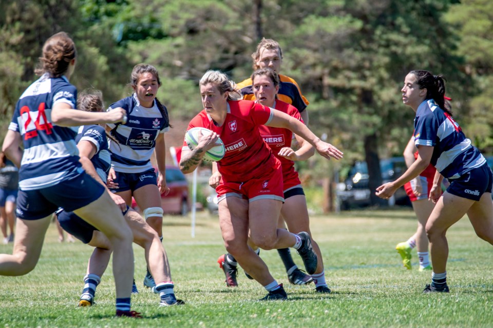Brittany Kassil of the Guelph Redcoats carries the ball during an Ontario Women's League rugby match against the Toronto Nomads. Kassil is a member of the Canadian national team that is to compete in next month's Women's World Cup in New Zealand.