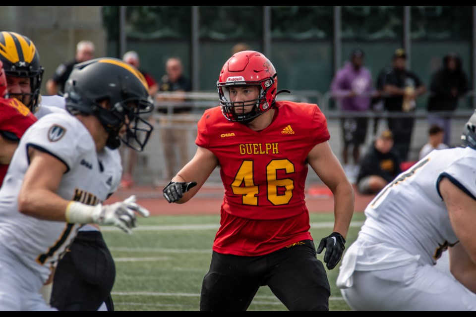 Middle linebacker Brandon Ferigo (46) of the Guelph Gryphons keeps his eye on the ball carrier during Guelph's home opener against the Windsor Lancers early last month. Ferigo leads the team in tackles in his first season as a starter.