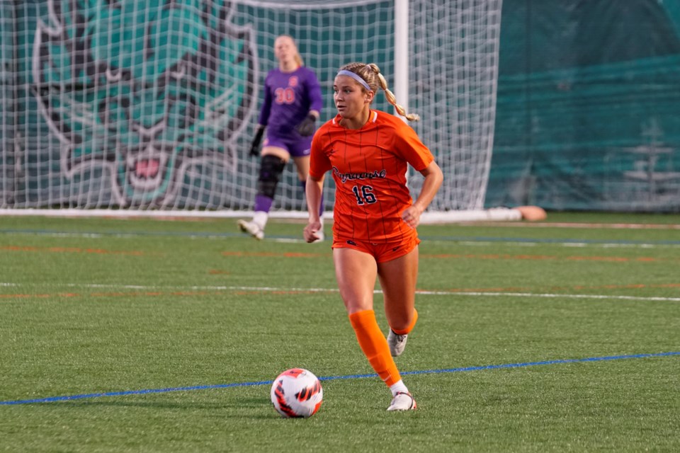 Midfielder Koby Commandant of the Syracuse Orange carries the ball during an NCAA game against the Binghamton Bearcats at Binghamton, N.Y. The Rockwood resident and John F. Ross CVI graduate scored a goal on the weekend in a tie with the second-ranked Virginia Cavaliers.