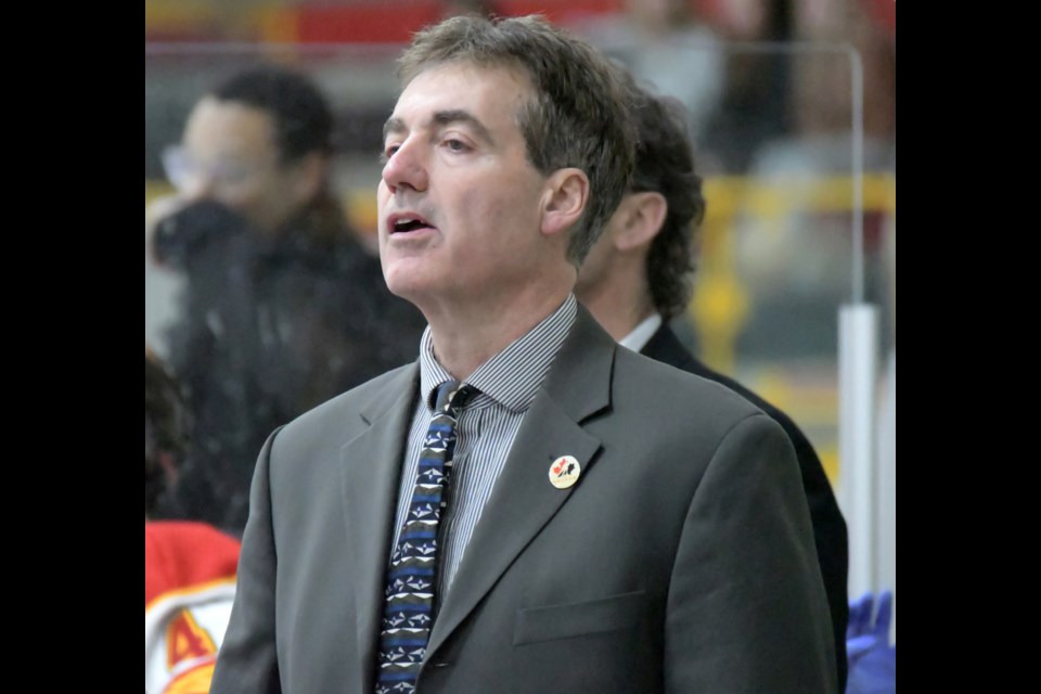 Head coach Shawn Camp of the Guelph Gryphons watches play during an Ontario universities men's hockey game at the Gryphon Centre early this season. Shawn's son Jaxon, a defenceman, is in his second season with the Gryphons.