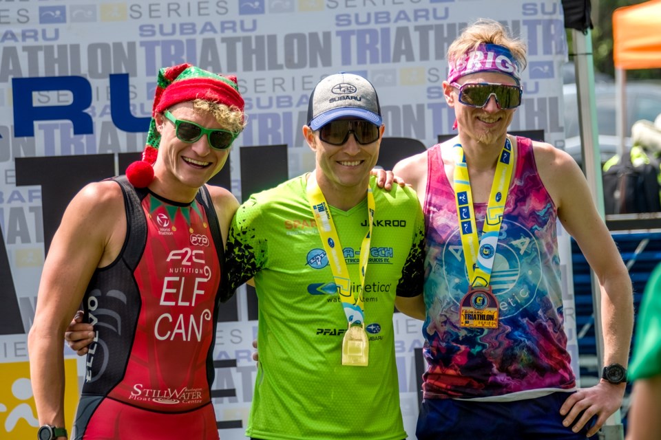 Guelph's Taylor Reid stands in the middle on the Subaru Triathlon Series' Guelph Lake I meet's Olympic triathlon pro men's podium after his victory there. Second was former University of Guelph varsity swimmer Jessey Elf (left) of Waterdown and Evert Lamb of Toronto was third.