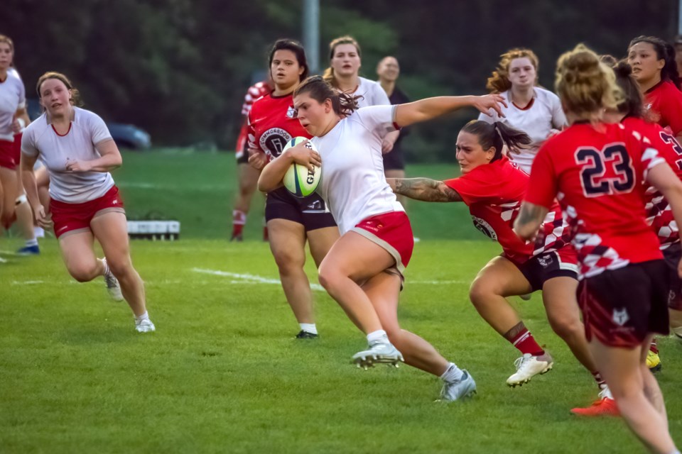 Guelph's Kayah Adamuszewski of the Guelph Redcoats carries the ball in the Rugby Ontario Women's League semifinal last month at the Guelph Lake Sports Fields. The Redcoats won the league title for the third consecutive season this year.
