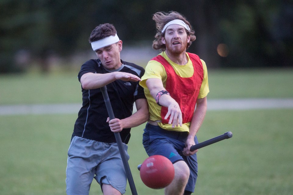 Two players collide during tryouts for the University of Guelph Quiddich Club on Johnston Green held Monday. Kenneth Armstrong/GuelphToday