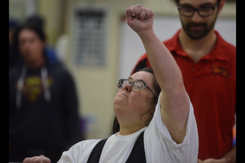Sarah Orgar of Brantford celebrates her successful lift in the squat at the 1st annual University of Guelph Gryphon Football Special Olympics Powerlifting Meet Saturday, March 3, 2018, at the University of Guelph. Tony Saxon/GuelphToday
