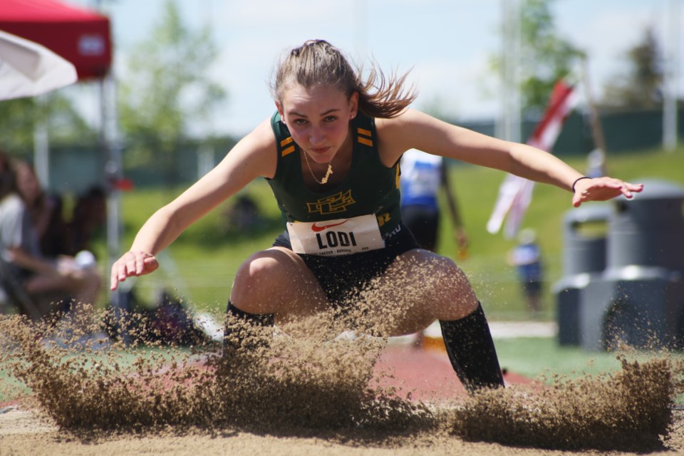 Aurora's Csenge Lodi represented Cardinal Carter High School while competing in the midget women's long jump during Thursday's OFSAA Track and Field Championships at Alumni Stadium in Guelph. Competition continues Friday and Saturday. Kenneth Armstrong/GuelphToday
