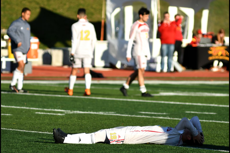 Chris Jacovou of the Guelph Gryphons lays on the turf as he tries to take in Guelph's 3-2 semifinal loss to the UQAM Citadins of Montreal at the U Sports men's soccer championship tournament at Alumni Stadium Saturday. The Gryphs will play in the bronze-medal match Sunday. Rob Massey for GuelphToday