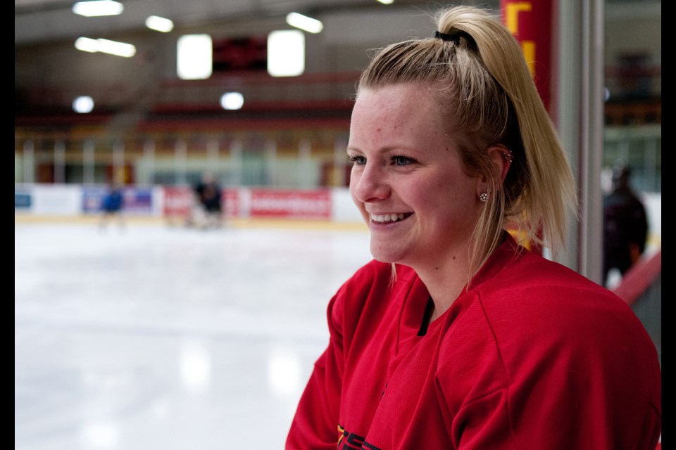 Averi Nooren of the Guelph Gryphons gets a laugh as she watches the defencemen practice during a workout session Wednesday at the Gryphon Centre. Nooren leads the top-ranked Gryphs in scoring with 13 goals and eight assists.