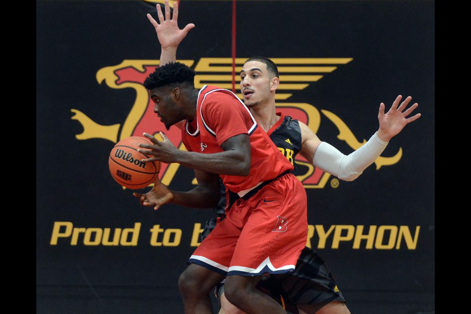 Ahmed Haroon of the Guelph Gryphons, right, defends against a member of the Brock Badgers Saturday, Feb. 27, 2016, at the Mitchell Athletics Centre. Tony Saxon/GuelphToday