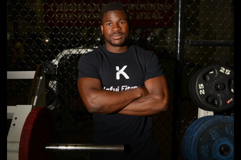 Kafui Hotsanyame poses in Gold Gym. Tony Saxon/GuephToday