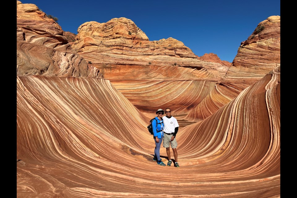 Retired U of G professor Reggie Y Lo and his wife Lisa hike The Wave.