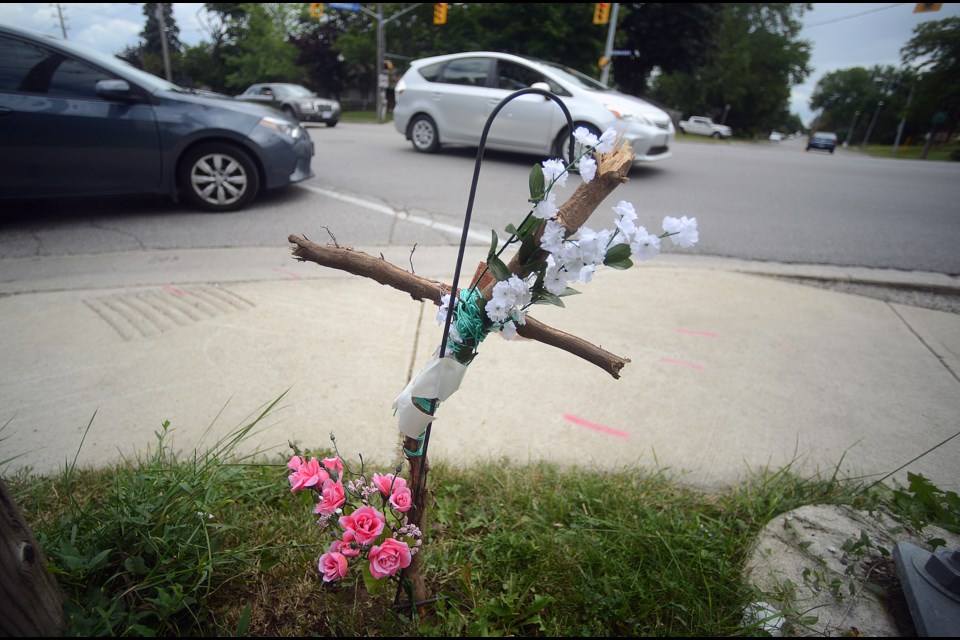 A makeshift memorial sits on the grass beside the intersection at Kathleen Street and Speedvale Avenue West, where a 77-year-old man was hit by a car on July 29, 2017. He later passed away in hospital. Tony Saxon/GuephToday