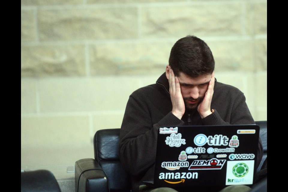A student works on his group's project at the Guelph Hacks For Mental Health event at the University of Guelph Saturday, March 11, 2017. Tony Saxon/GuelphToday
