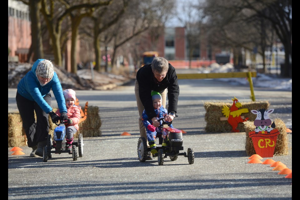 A couple of tractor drivers get some help from mom and dad at College Royal 2019 on Saturday at the University of Guelph. Tony Saxon/GuelphToday