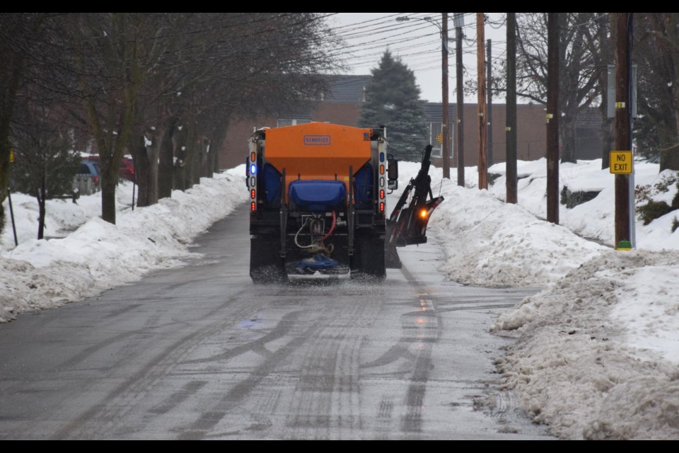 In-salting. A city truck makes a pass on a west side residential street Monday morning as rain iced up city streets. Rob O'Flanagan/GuelphToday