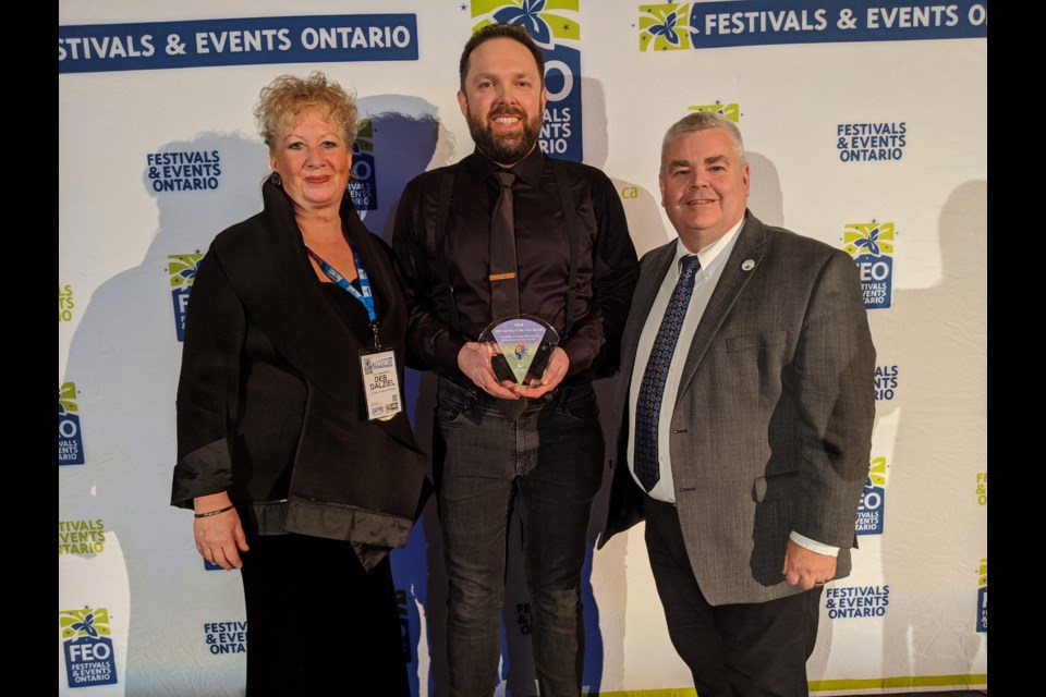 (L to R) Deb Dalziel, tourism and destination coordinator, Spencer Shewen, community development, culture and special events coordinator, and Andy Goldie, CAO accept the FEO Municipality of the Year award for Centre Wellington. Supplied photo