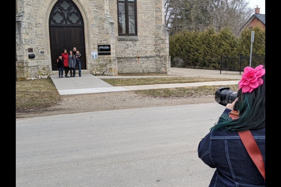 Christa Niravong and family get their front porch photo at their home and business in Elora. Supplied photo