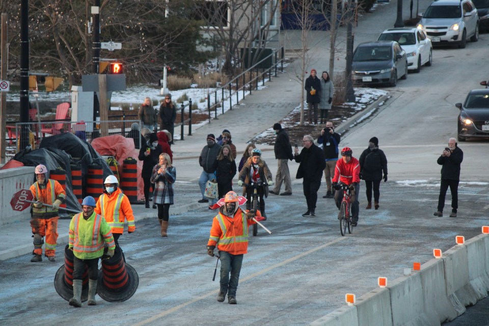 The construction team and residents took a celebratory walk across the reopened Badly Bridge on Friday.