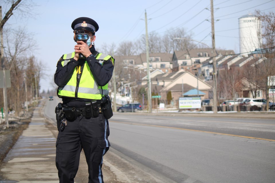 Cst. Darryl Unger uses LIDAR to conduct speeding enforcement near Rockwood cemetery.