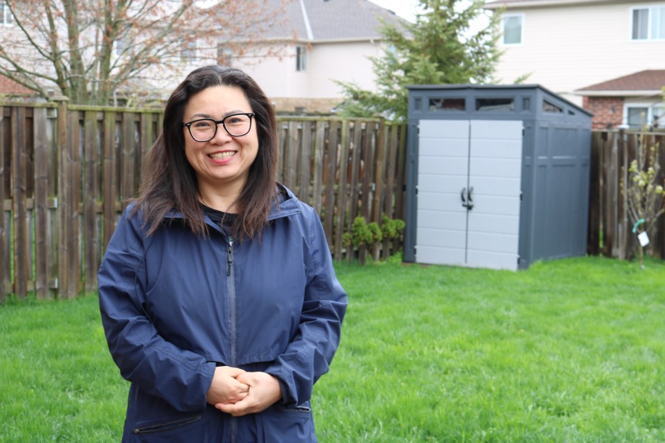 Maria Miao in her private dog park and backyard, PETme.