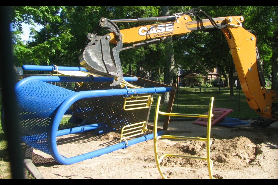 An excavator removes parts of the playground. Supplied photo. 