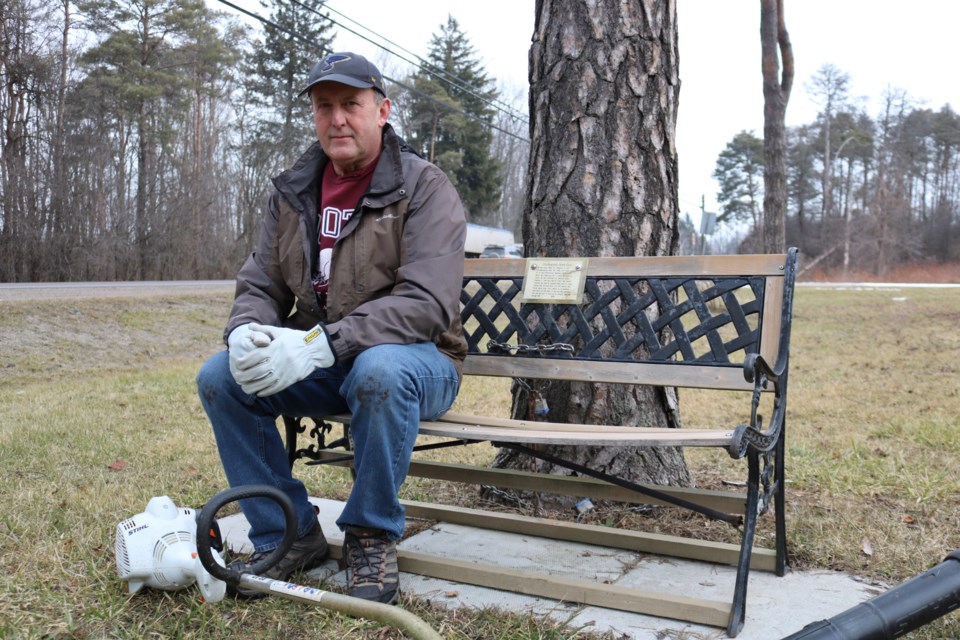 Keith Porty sits on the bench he built overlooking the Jane Doe Memorial in Rockwood.