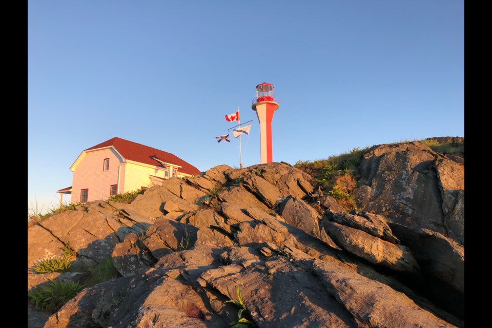 Cape Forchu Lighthouse in Yarmouth during sunset