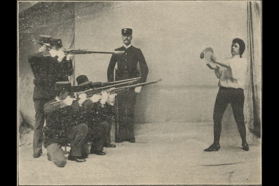 Adelaide Herrmann faces a firing squad ready to catch their bullets with a plate. The
Halifax theater manager wrote that “Madame Herrmann caused a furore” during her 1896 appearance in the city