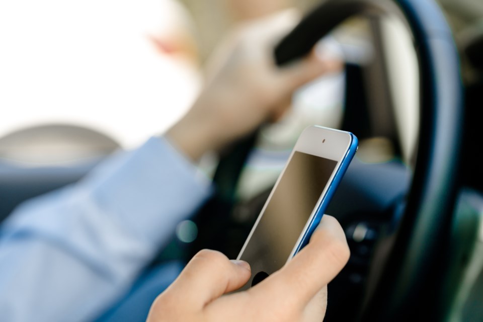 010618-distracted driving-driver-cell phone-adobeStock_87602520