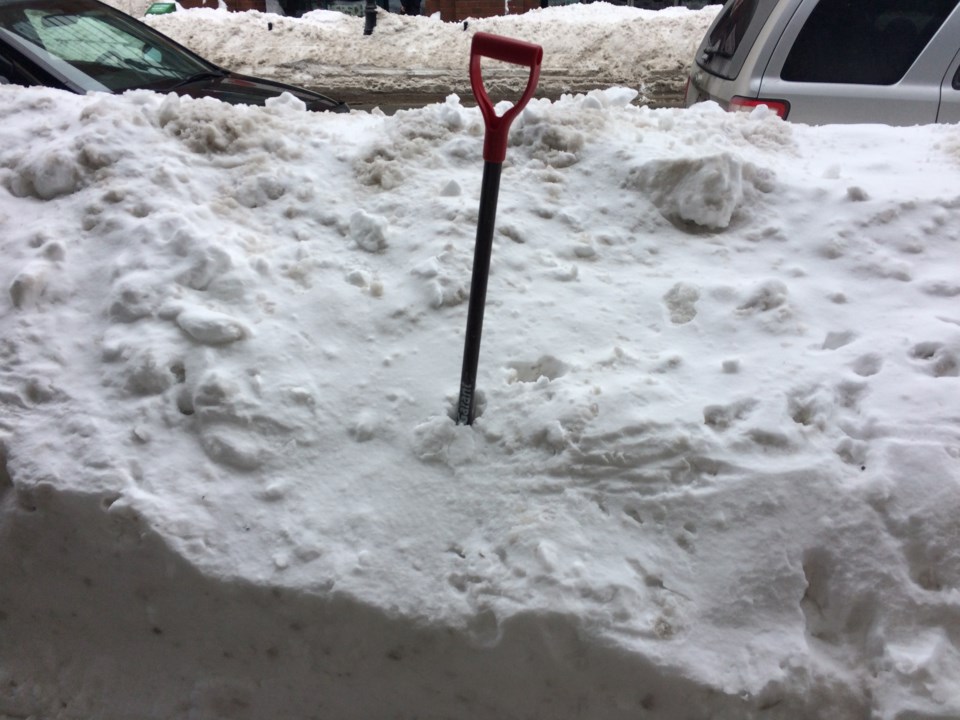 101317-shovel-snow removal-winter storm-snow bank-generic-MG