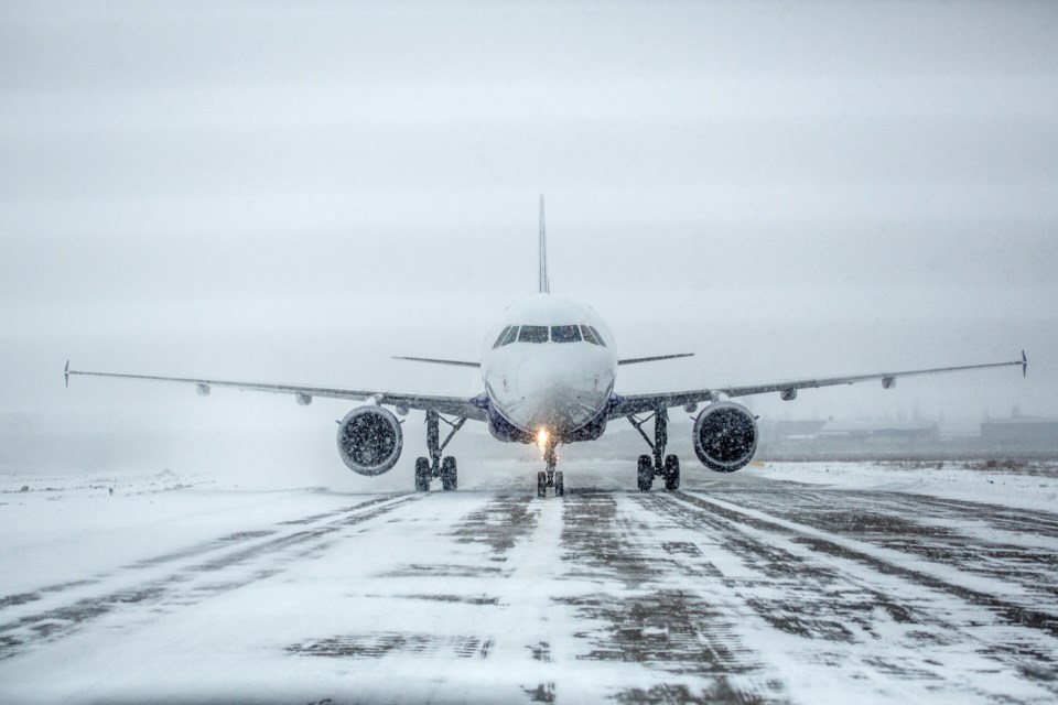112819-airplane-airport winter snow runway -AdobeStock_195260599