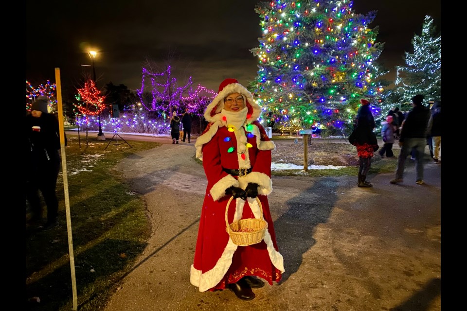 Urszula Perkins spreads holiday cheer during the Light up the Hills ignition night festivities at Dominion Gardens Park Dec. 1.